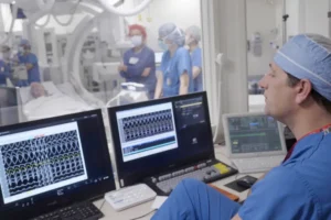 Dr. Phillip Cuculich works with others to prepare for an experimental treatment using radiation for Jeff Backus' irregular heartbeat in St. Louis on Tuesday, Feb. 7, 2023. Detailed medical scans give Cuculich a three-dimensional map pinpointing where the heartbeat goes awry.