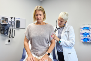 Dr. Schmidt, meets with patients for checkups at West County at the clinic.