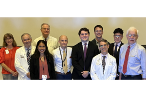 (L-R) Ann Ahrens, William Chapman, MD (mentor); Vinathi Polamraju, MD (front), Jeffrey Crippin, MD (mentor); Justin Vader, MD (mentor); Justin Vincent, MD (purple tie), Scott Beeler, MD (back row); Brian Gage, MD (MiM Director, front w/white coat); Michael Kwok, MD; Seth Eisen, MD, (MiM Assoc. Director).