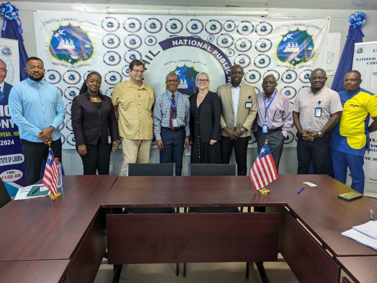 DOLF PI Dr. Peter Fischer (3rd from left), associate director Laura Peer (center) and trial project manager, Cooper Sannah (right) met with NPHIL Director General Dr. Dougbeh Chris Nyan (4th from left) and his leadership team