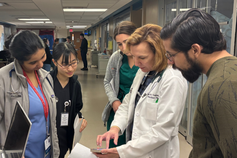 WashU Medicine Division of Infectious Diseases co-chief Barbara Trautner, MD, PhD, discusses a patient's case with First Year Fellow Laveena John, MD, visiting medical student Hiyori Mori, medical student Elisa Carrillo, and senior clinical research coordinator Johanan Luna during ID rounds at Wohl Hospital on March 16, 2026.