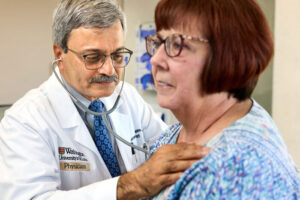 Sumanth Prabhu, MD, director of the Cardiovascular Division at Washington University School of Medicine in St. Louis, uses a stethoscope to examine Pam Aydt, a patient in his practice. Prabhu is a heart failure specialist who combines his passion for patient care with his interest in understanding the role of inflammation in heart failure.