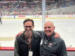 Washington University medical oncologist Russell Pachynski, MD, and his patient Kerry Preete attend a St. Louis Blues game.