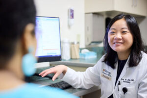 Amy Zhou, MD, a hematologist at Washington University School of Medicine in St. Louis, sees a patient at Siteman Cancer Center's West County facility in Creve Coeur. Zhou treats patients with various blood disorders and conducts clinical trials investigating possible new therapies for such patients.
