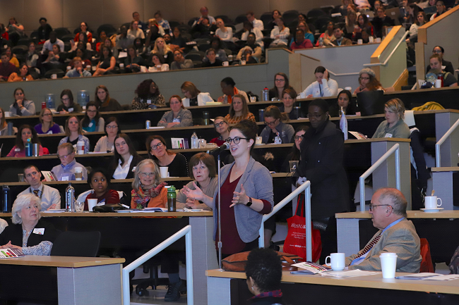 A lady speaking at a Public Health conference. 